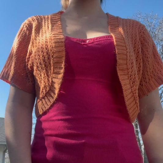 Knit minded orange shrug sweater