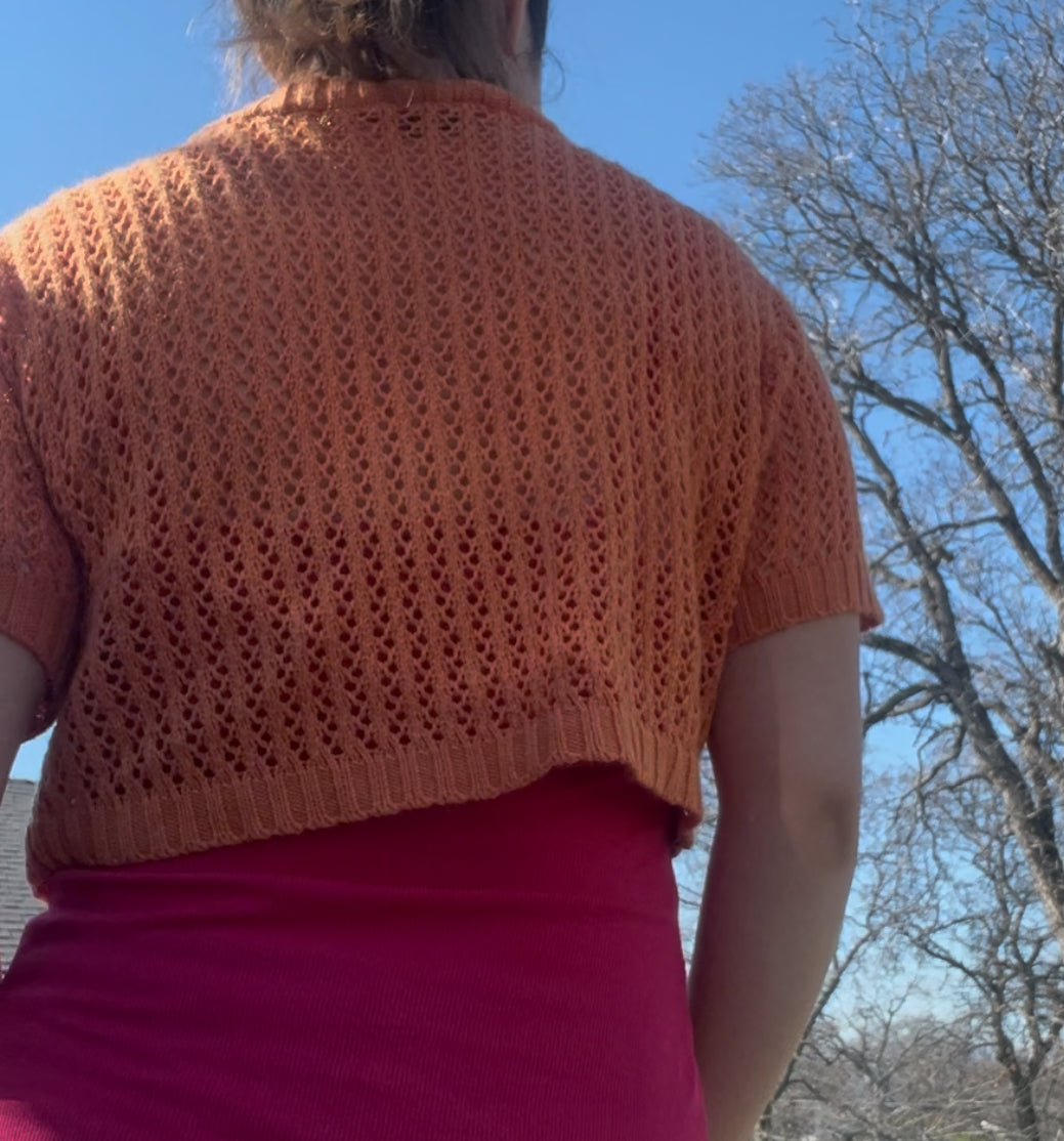 Knit minded orange shrug sweater