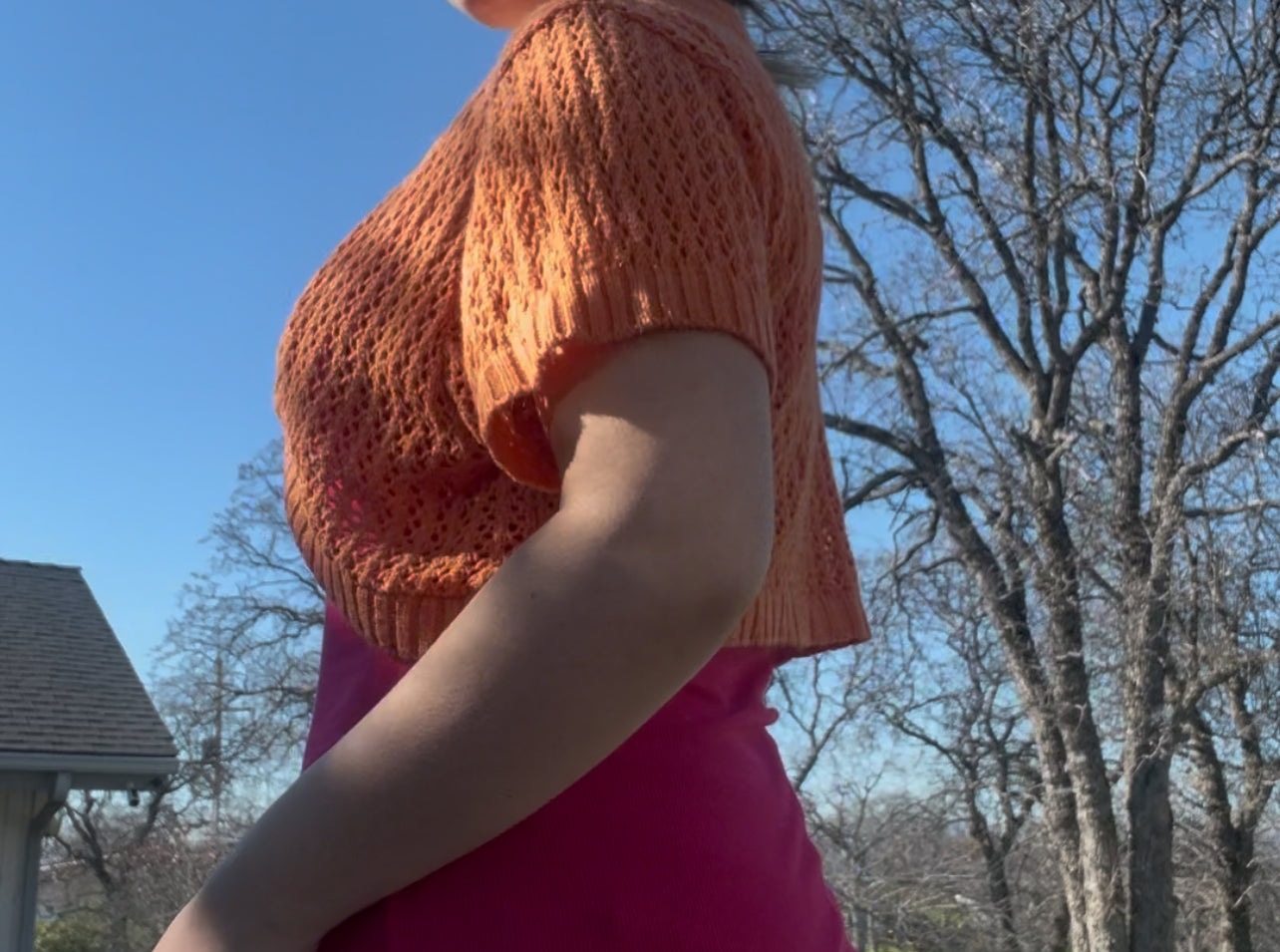 Knit minded orange shrug sweater